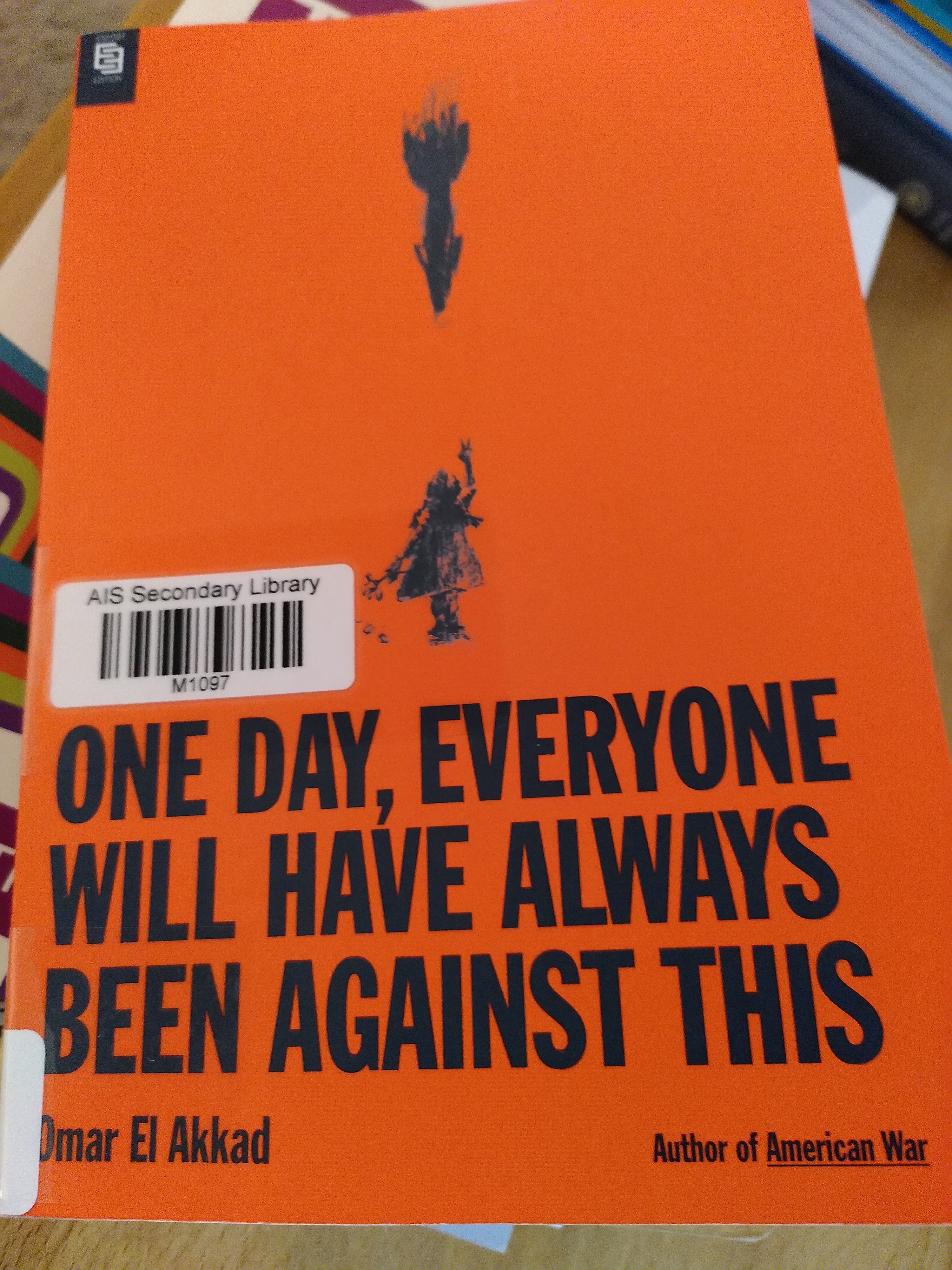 Red book cover with pencil drawing of small girl looking up, speeding missile falling directly down towards her. Book title in bold black letters at bottom of cover.